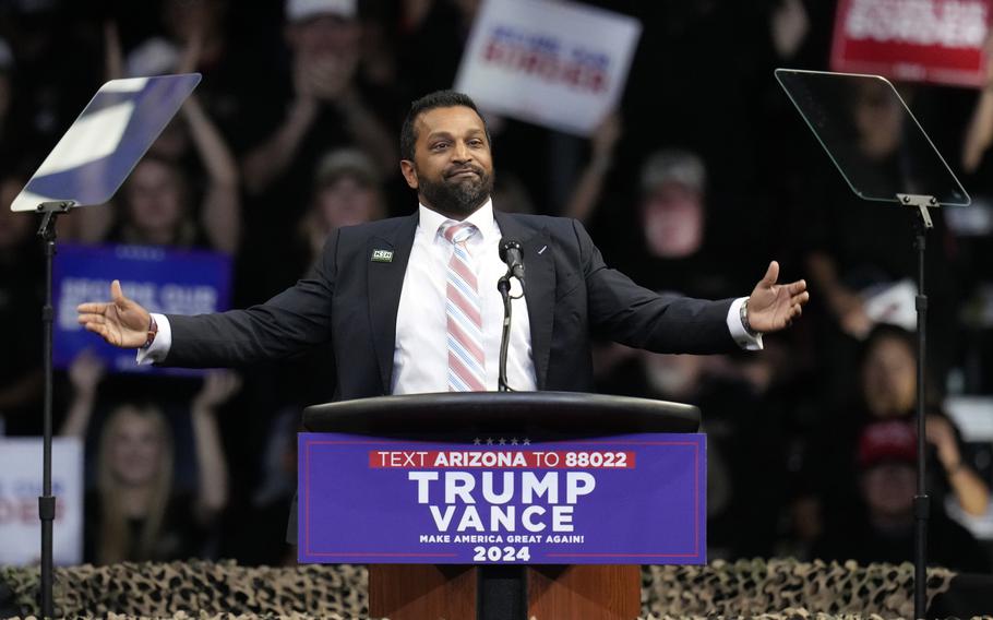 Kash Patel, with his arms outstretched, speaks at a campaign rally.