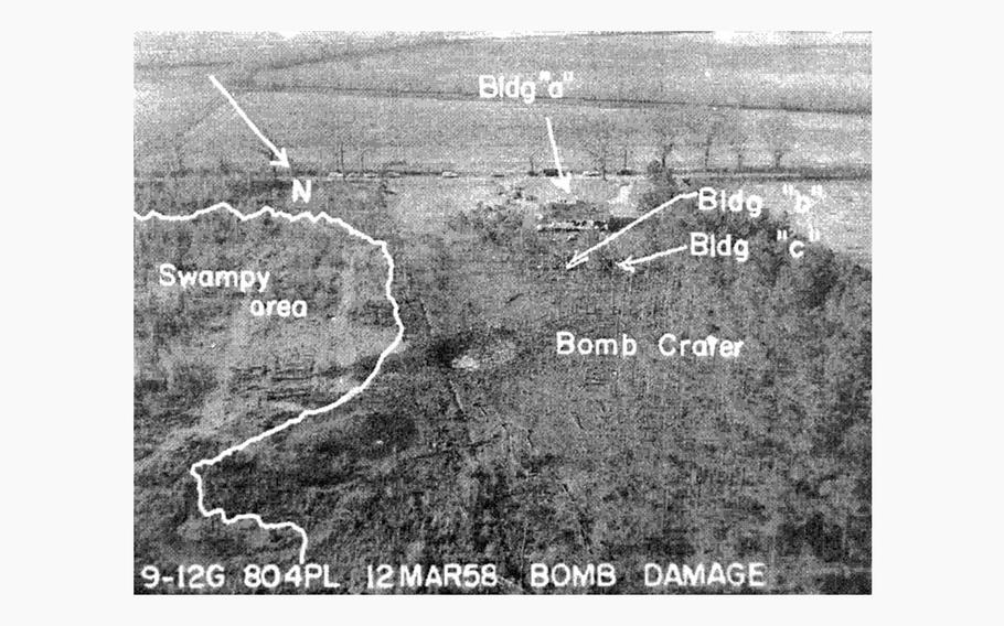 An aerial view of the impact site, showing the bomb crater and the buildings of the nearby Gregg property, outside Florence, S.C., in 1958.