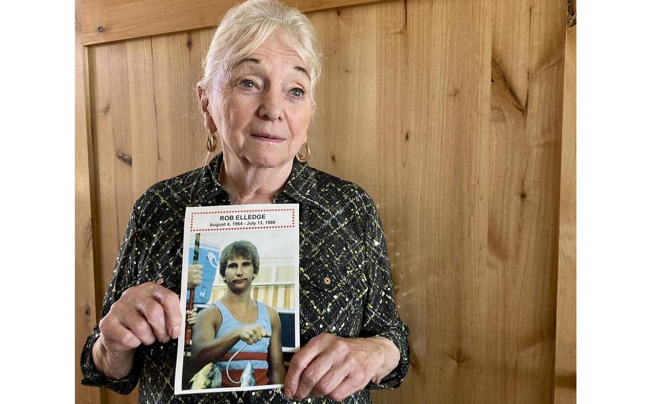 Mary Elledge holds a photograph of a picture taken in Oregon City, Ore., of her only son, Rob Elledge, on Oct. 27, 2022, who was killed in 1986. Elledge, president of the Portland chapter of Parents of Murdered Children, is a registered Democrat but this November she will vote for the independent candidate for Oregon governor because she feels Democrats are too progressive on issues like bail and sentencing reform and early release. 