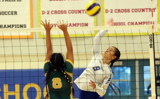 Yokota's Erica Haas spikes against Robert D. Edgren's Amber Baltazar during Friday's DODEA-Japan volleyball match. The host Panthers won in three sets.