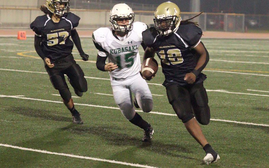 Humphreys' Joshua Canion tries to outrun Kubasaki's Lukas Gaines.