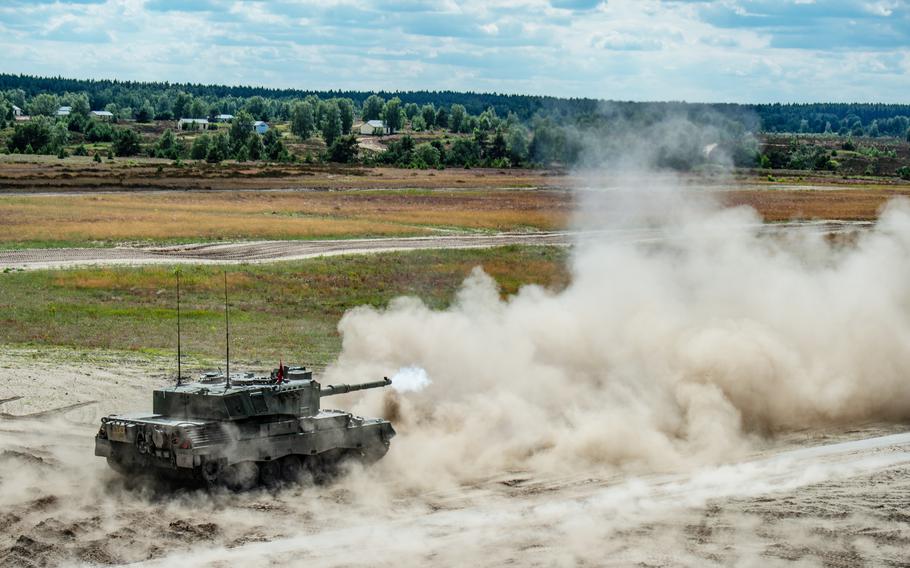 A Leopard 1 A5 tank fires its 105 mm cannon during a live-fire exercise June 13, 2024, at Klietz training range, Germany.