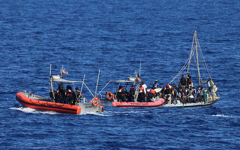 Crews with the Coast Guard Cutters Seneca and Raymond Evans stop a 33-foot a migrant vessel about 48 miles north of Cap-Haitian, Haiti, on June 30, 2023.