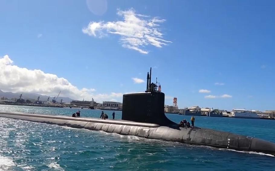 The Virginia-class fast-attack submarine USS Minnesota transits Pearl Harbor, Hawaii, on June 20, 2024, as it begins sea trials after undergoing a two-year maintenance period.