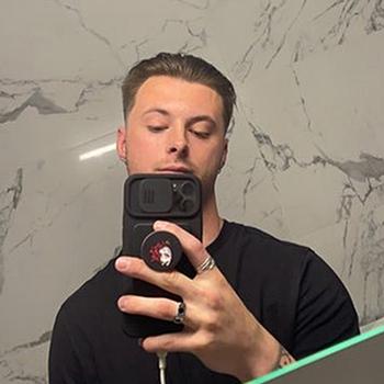 Airman 1st Class Grant Harrison is seen in a mirror selfie he posted to his X social media account. Harrison, stationed at Spangdahlem Air Base in Germany, was acquitted of premeditated murder and other charges after a military trial.