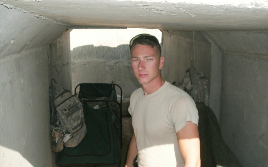 Chris Arthur stands in a concrete structure in Iraq.