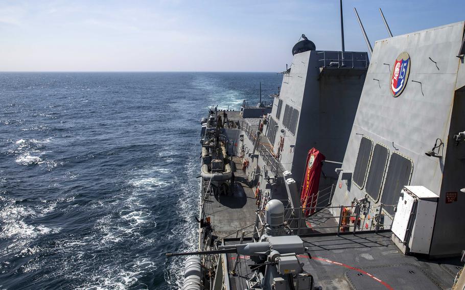 The guided-missile destroyer USS Ralph Johnson steams through the Taiwan Strait, Thursday, Aug. 22, 2024.