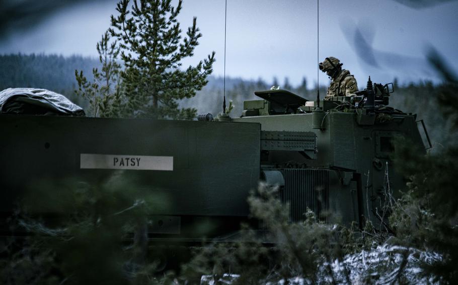 Soldiers prepare to fire the M270A2 Multiple Launch Rocket System.