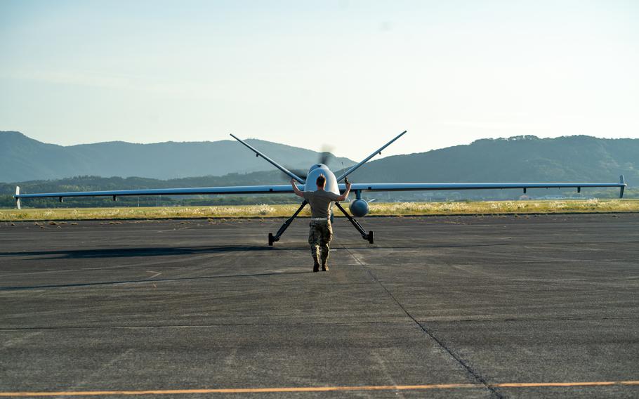 An MQ-9 Reaper of the 319th Expeditionary Reconnaissance Squadron taxis before a demonstration flight at Kanoya Air Base, Japan, on Nov. 5, 2022. 