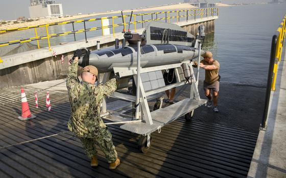 Sailors with the Navy’s Task Force 59 launch a drone boat from a pier at Naval Support Activity Bahrain in 2022. The recent U.S.-led IMX 25 exercise in the Middle East focused on advancing artificial intelligence and unmanned systems as the Navy and its regional partners adapt to evolving threats in the region.