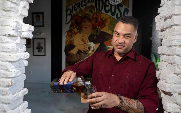 Retired U.S. Marine Major Eric Dominijanni is photographed pouring his FIOR Scotch at a restaurant on Wednesday, Nov. 13, 2024, in Miami, Fla. FIOR is a Black-owned scotch brand that Dominijanni launched and owns.