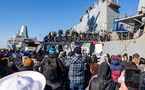 NORFOLK, Va. (December 23, 2024) Sailors assigned to the Arleigh Burke-class guided-missile destroyer USS Cole (DDG 67) depart the ship after returning from deployment. Cole returned to Naval Station Norfolk after a deployment in support of maritime security and stability efforts in the U.S. 5th and 6th Fleet areas of operation. (U.S. Navy photo by Mass Communication Specialist 1st Class Nathan T. Beard/Released)