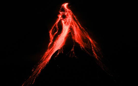 mayon-volcano-belches-red-hot-emissions-down-it-s-slope-as-seen-from