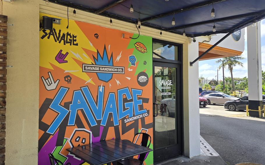 The exterior of Savage Sandwich Co. in Tumon, Gwam, is brightly painted in a graffiti style.