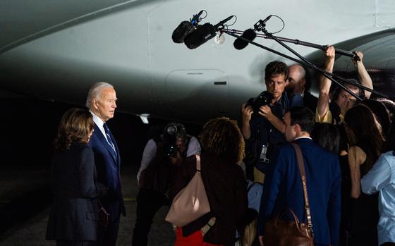 President Biden and Vice President Harris speak to reporters at Joint Base Andrews late Thursday. 