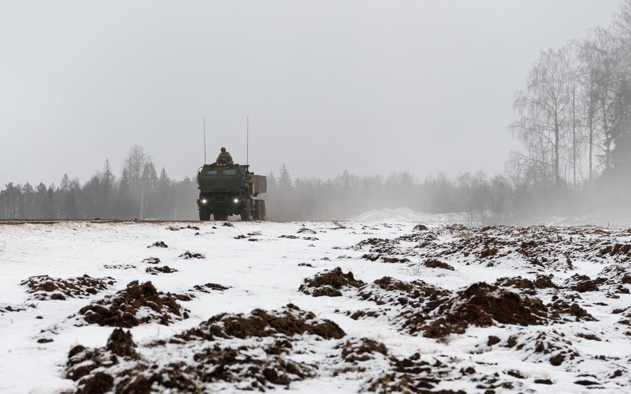 A High Mobility Artillery Rocket System drives through rough terrain.