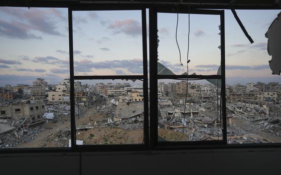  A view through a window of a destroyed area in Gaza City.