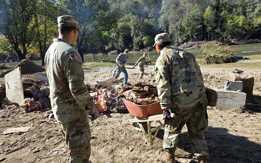 Soldiers with the XVIII Airborne Corps assist in clearing debris in western North Carolina following Hurricane Helene. 