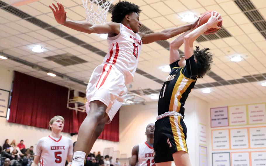 Isaiah Kimbrough soars to block a shot.