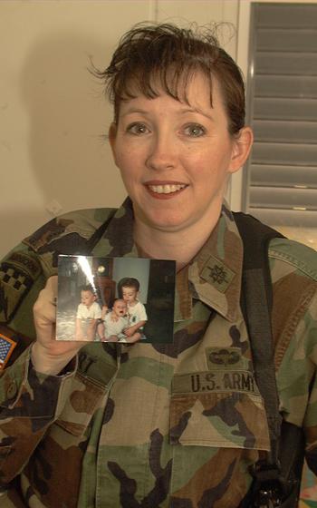 Maj. Lindy Stuart saw her youngest son crawl for the first time via a video hookup between Eagle Base, Bosnia and Herzegovina, and Hawaii, where her children are. She expects to miss all three of her sons' birthdays this year because of her deployment.