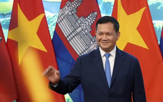 FILE - Cambodian Prime Minister Hun Manet poses for photo, along with Vietnamese Prime Minister Pham Minh Chinh, not in photo, in Hanoi, Vietnam on Monday, Dec.11, 2023.  (AP Photo/Hau Dinh, File)