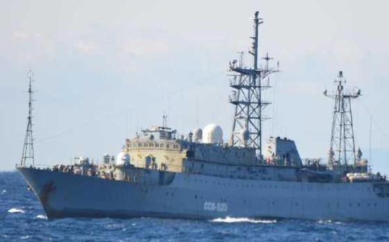 The Russian navy Vishnya-class intelligence-gathering vessel, number 535, is seen on the water.