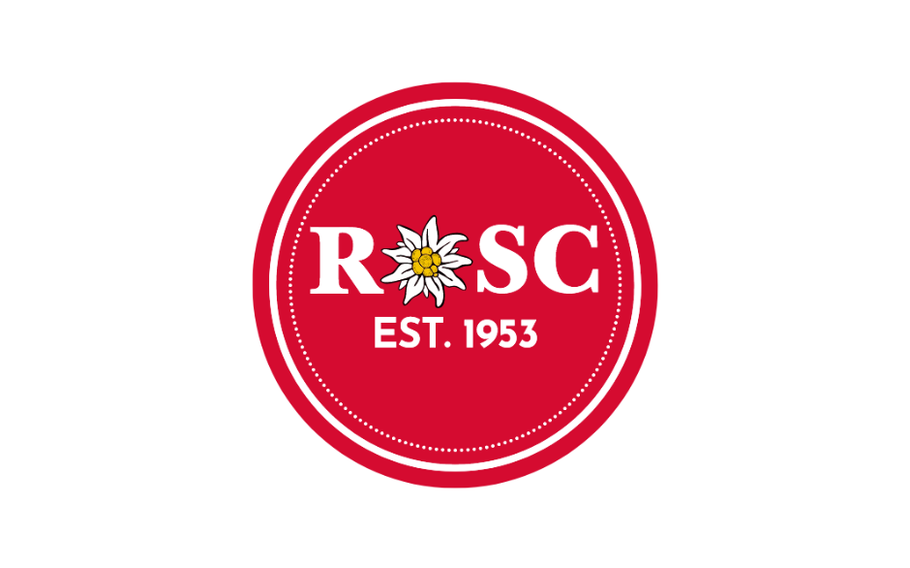 The letters ROSC and EST. 1953 in white on a red circle. The “O” in the ROSC is replaced with a white dandelion.