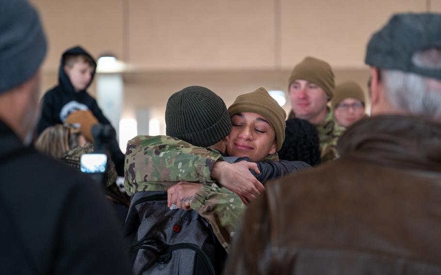 Airman Anita Alvarez embraces her family