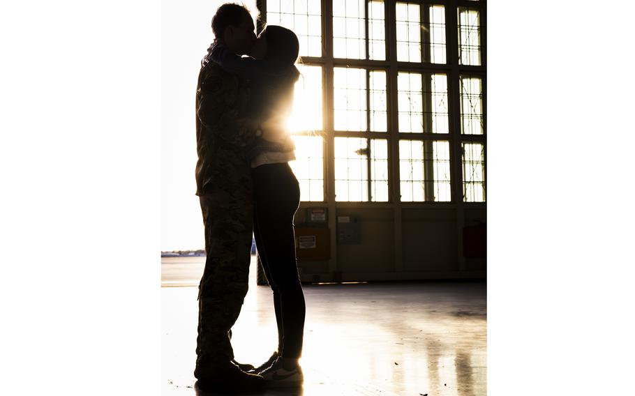 Airman embraces a loved one