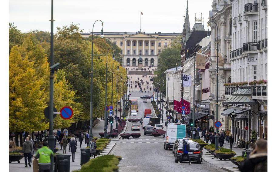 The Royal Palace beyond stores and restaurants along Karl Johans Gate in Oslo, Norway, on Oct. 17, 2023. 