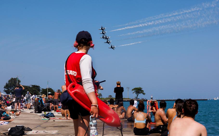 People watch the U.S. Air Force Thunderbirds perform during the Chicago Air and Water show near North Avenue Beach on Aug. 20, 2023, in Chicago.