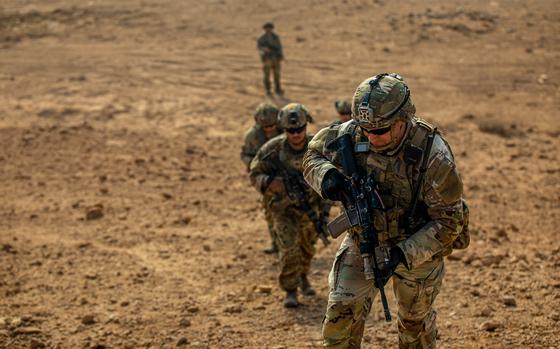 U.S. Army Staff Sgt. Kyle Grover assigned to Charlie Company, 2nd Battalion, 22nd infantry regiment, 1st Brigade Combat Team, 10th Mountain Division, leads a group of soldiers to the top of a hill, at Al Asad Air Base, Iraq, Nov. 18, 2022.Patrols of the amber zone are conducted in order to identify possible threats to the area of operation. In coordination with partner Iraq Security Forces to advise assist and enable them in the enduring defeat of ISIS. (U.S. Army photo by Sgt. Julio Hernandez)