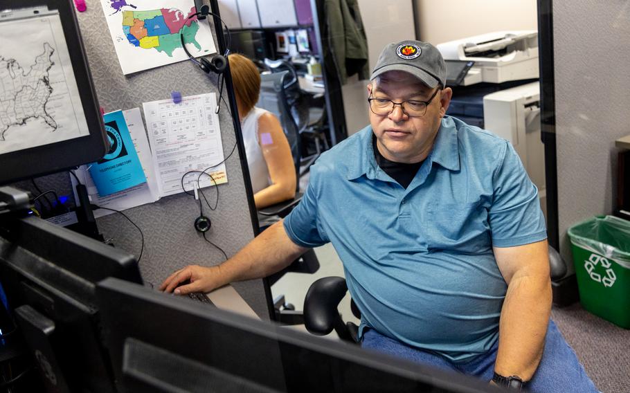 Steve Larrabee, a fire and files analyst, looks up fire reports in his office at the National Interagency Coordination Center in Boise. “It’s pretty spicy out there,” he said about the current fire situation. 