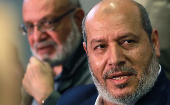 Senior official of the Palestinian Islamic Jihad movement, Abdulaziz al-Minawi, and Hamas Arab relations chief Khalil al-Hayya (right) hold a press conference during a visit to the Syrian capital Damascus on Oct. 19, 2022.