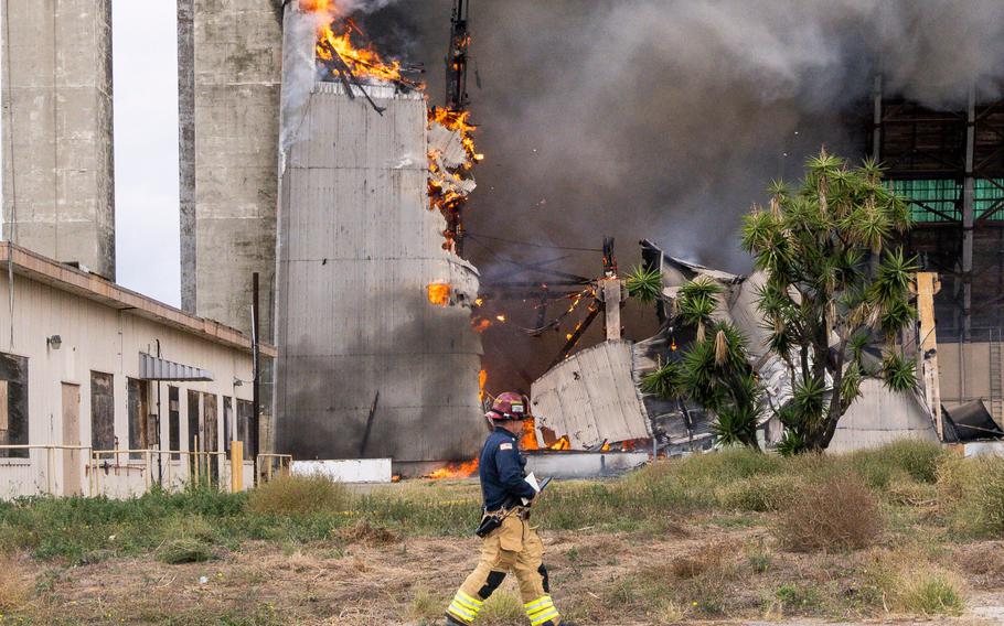 Orange County firefighters battle a fire affecting the north hangar at the former Marine Corps Air Station Tustin in Tustin, CA on Tuesday, Nov. 7, 2023.