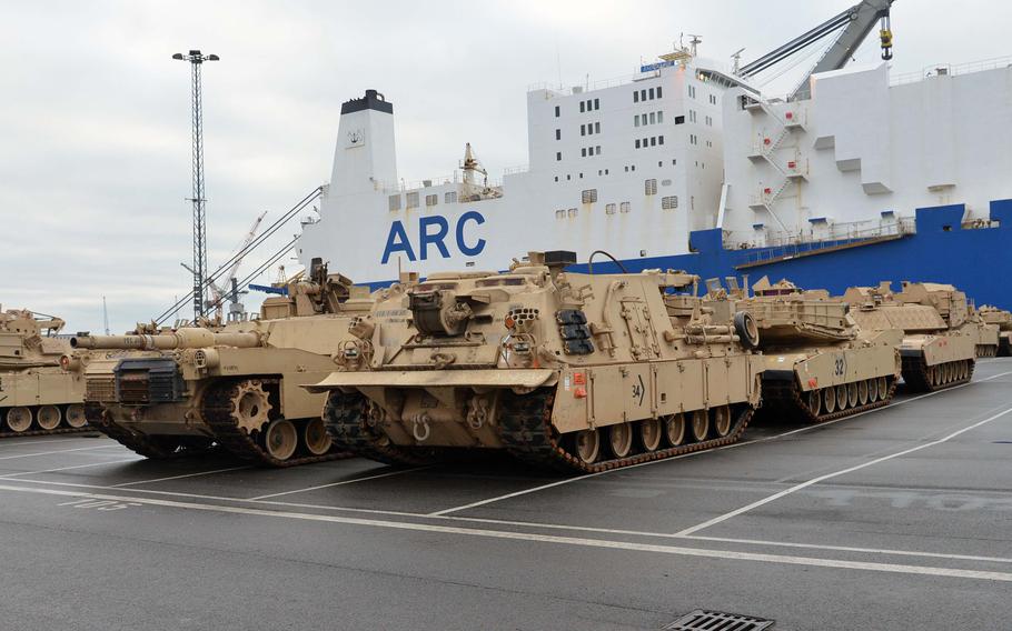 Armor belonging to 3rd Armored Brigade Combat Team, 4th Infantry Division, out of Fort Carson, Colo., sits in the port of Bremerhaven, Germany, in 2017, after being unloaded for the ABCT's nine-month rotation in Poland. Should former President Donald Trump return to the White House, the rotation of armor brigades to Europe could be one thing on the chopping block as focus turns towards China, analysts say. 
