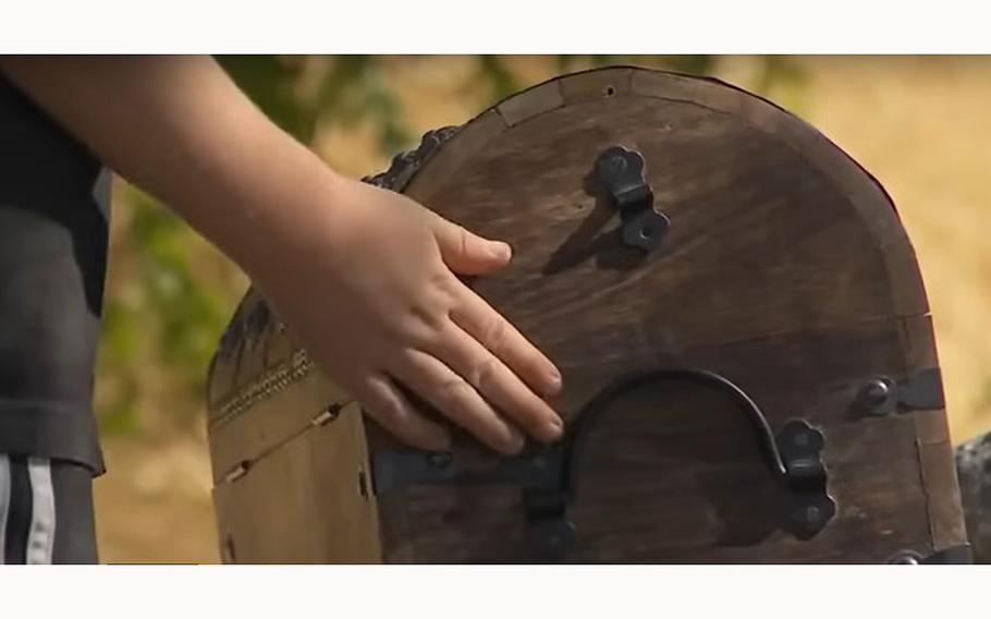 A video screen grab shows the chest worth $25,000, which a father and son found, solving the 2024 Utah Treasure Hunt.