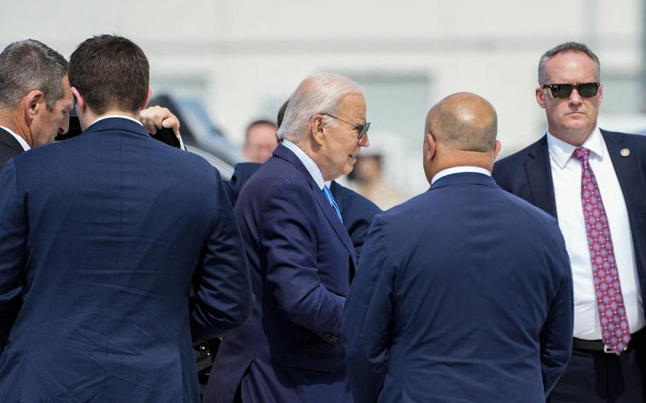 President Joe Biden exits his motorcade on his way to board Air Force One as he departs Harry Reid International Airport in Las Vegas, Nevada, on July 17, 2024, en route to Delaware. Biden was experiencing “mild symptoms” after testing positive for COVID during a campaign trip to Las Vegas on Wednesday.. 