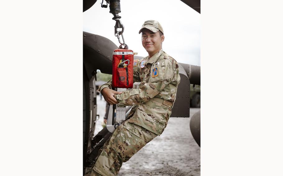 A U.S. Army solider demonstrates a harness system on a static helicopter at the 63rd Annual German-American Volksfest on Camp Algiers, Grafenwoehr, Germany from August 2-4, 2024.