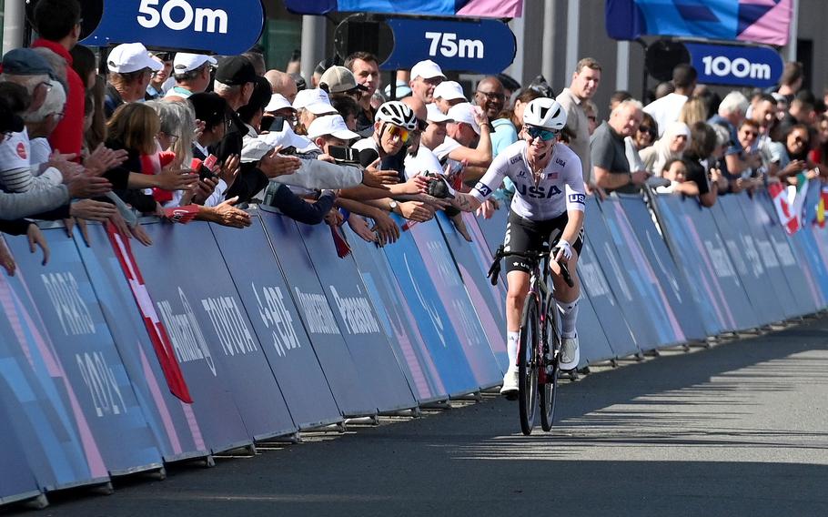 American Samantha Bosco is congratulated by fans as she rolls to the finish line, placing fourth in the C4-5 road race at the 2024 Paris Paralympics in Clichy-sous-Bois, France, Sept. 6, 2024.