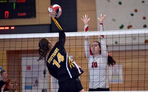 Kaiserslautern middle blocker Mariska Campbell goes for the block against Stuttgart hitter Hannah Holmes during an Oct. 5, 2024, match at Kaiserslautern High School in Kaiserslautern, Germany.