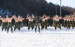 HED: Jumping snow jacks, 2017

Pyeongchang, South Korea, Dec. 19, 2017: U.S. and South Korean Marines get airborne during a short workout. 

About 400 U.S. and South Korean Marines took a break from honing their winter-warfare skills for some friendly competition. After doffing their shirts and yelling half-naked in the snow, the allies teamed up to battle each other in chicken fights, relay races and a free-for-all wrestling match.

Read the original article and see additional photos here.https://www.stripes.com/theaters/asia_pacific/2017-12-19/marines-frolic-in-s.-korean-snow-to-unwind-from-intense-winter-warfare-training-1536110.html1

META TAGS: USMC; U.S. Marine Corps; marines; 1st Battalion, 8th Marines; 6th Marine Regiment; Infantry