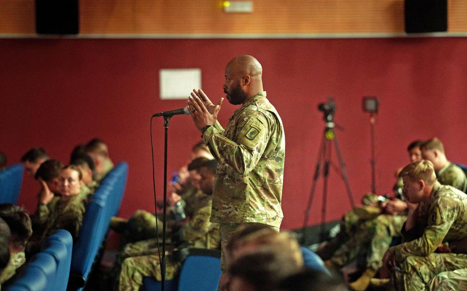 A 173rd Airborne Brigade soldier asks a question of Col. Matthew Myer and Chief Warrant Officer 2 John Hayes during a discussion in Vicenza, Italy, on July 1, 2024, about the Battle of Wanat in Afghanistan.