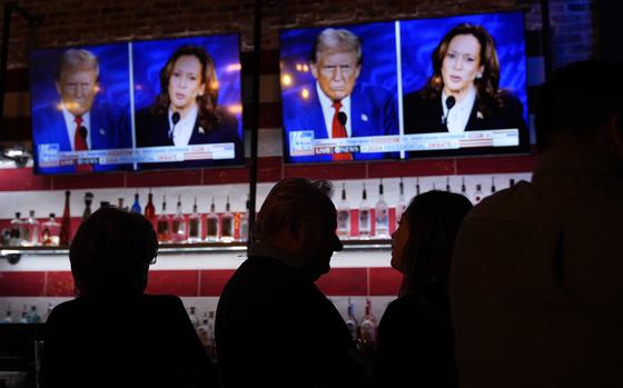 Viewers gather to watch a debate between Democratic presidential nominee Vice President Kamala Harris and Republican presidential nominee former President Donald Trump at the Angry Elephant Bar and Grill, Tuesday, Sept. 10, 2024, in San Antonio. (AP Photo/Eric Gay)