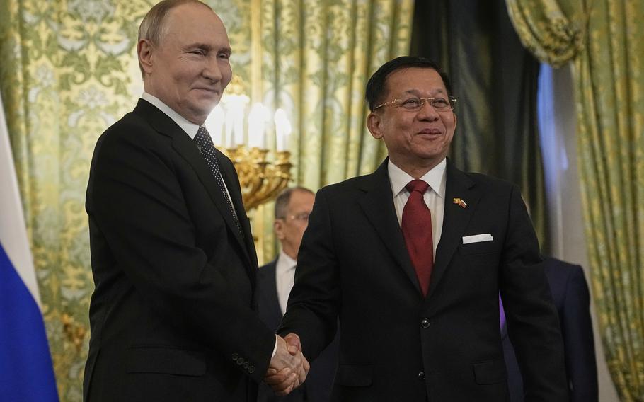 Russian President Vladimir Putin, left, and Myanmar’s Military leader Senior Gen. Min Aung Hlaing shake hands during their meeting at the Grand Kremlin Palace in Moscow, Russia, Tuesday, March 4, 2025.