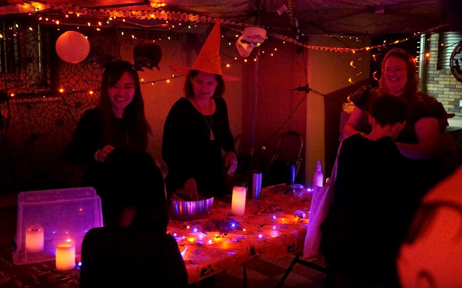 A trick-or-treaters collect Halloween candy outside a home at Yokosuka Naval Base, Japan, Oct. 31, 2024.