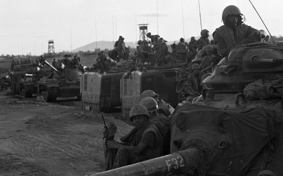 A tank and Marines move to position themselves on Go Noi Island