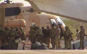 FILE - This undated photograph handed out by French military shows Russian mercenaries boarding a helicopter in northern Mali. (French Army via AP, File)