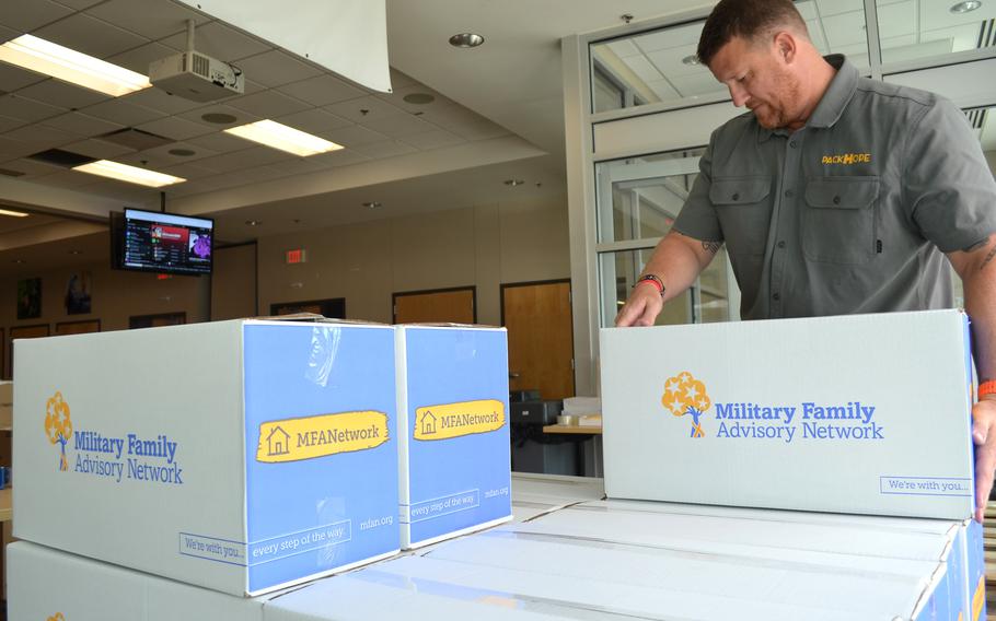 Boxes of household essentials and food to be distributed to military families who recently moved to Fort Cavazos, Texas. 