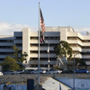 An American flag flies in front of the Department of Veterans Affairs campus building.